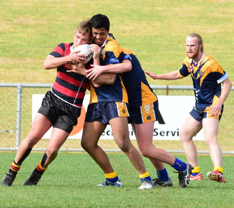Tight tussle: Dubbo's Clayton Couley (left) was again strong from lock. Photos: BELINDA SOOLE