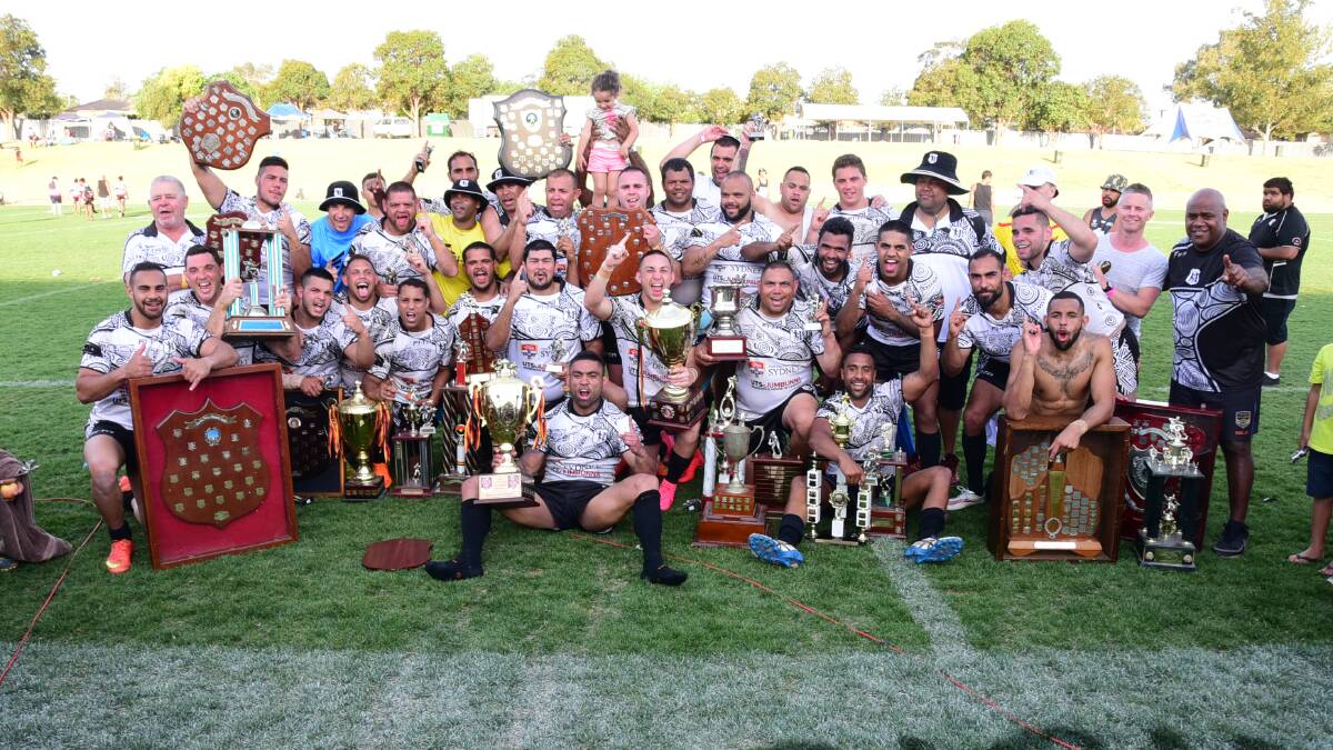 BACK AGAIN: The Redfern All Blacks celebrate their Knockout win at Dubbo in 2015. Photo: FILE