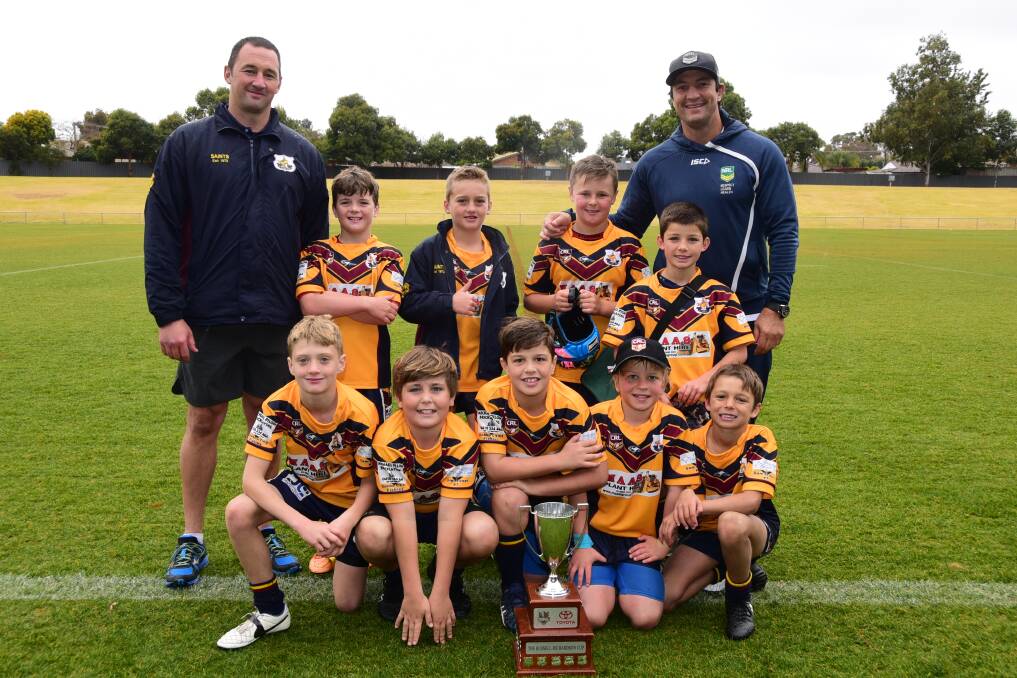 WINNERS: The victorious St Mary's side with coach Wes Maas and NRL great Nathan Hindmarsh. Photo: BELINDA SOOLE
