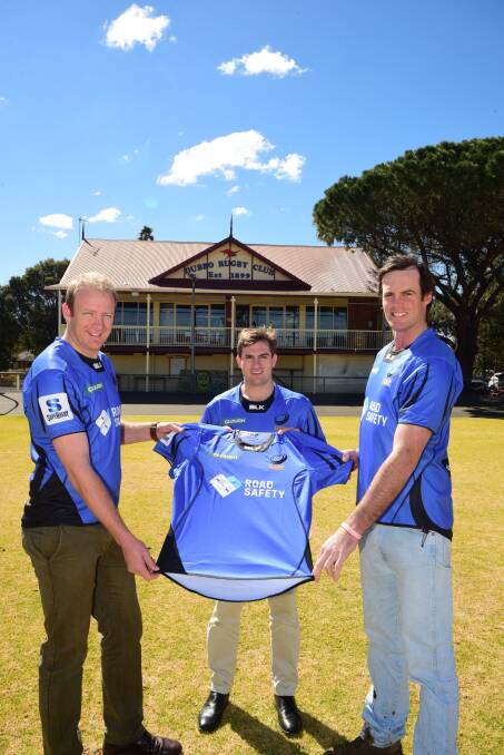 SUPPORT: Roos players (from left) Simon Hegarty, Jock Brownhill and Shaun McHugh with the Western Force jerseys to be worn on Saturday. Photo: BELINDA SOOLE