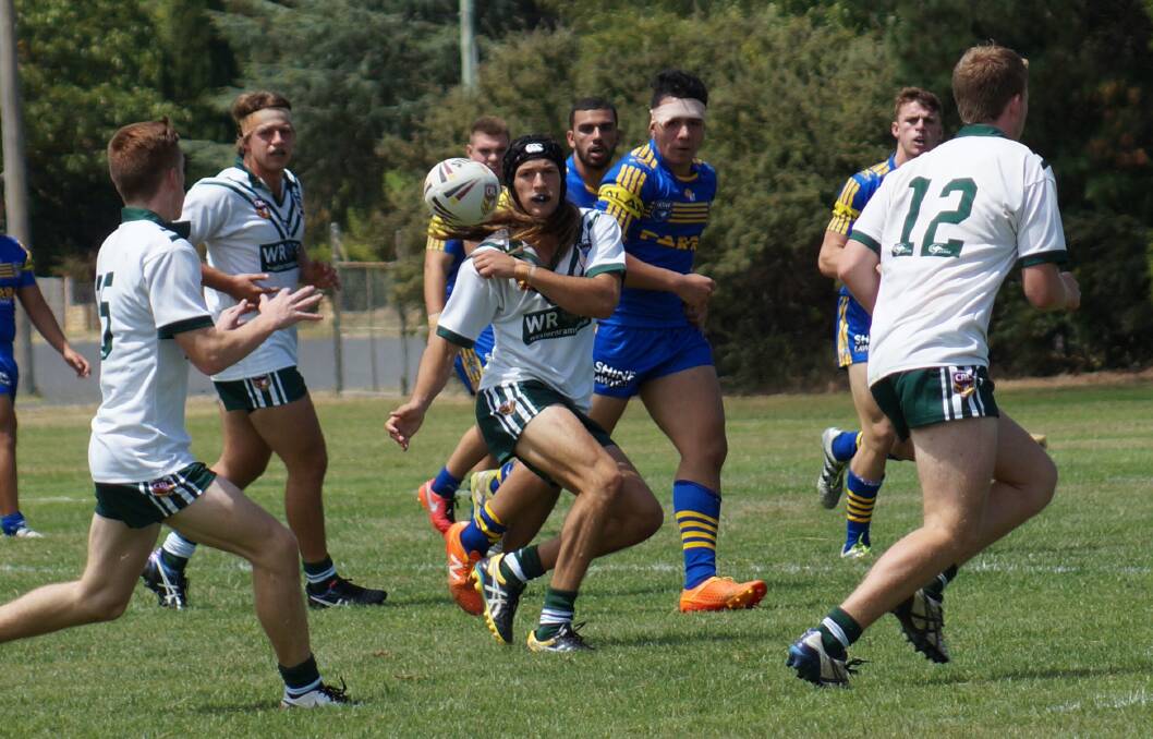 SPREAD IT: Dubbo CYMS youngster Bayden Searle in action for the Western Rams during what was a tough hit-out against Parramatta's Senior Talent Squad at Blayney on Saturday. Photo: MARGARET POND
