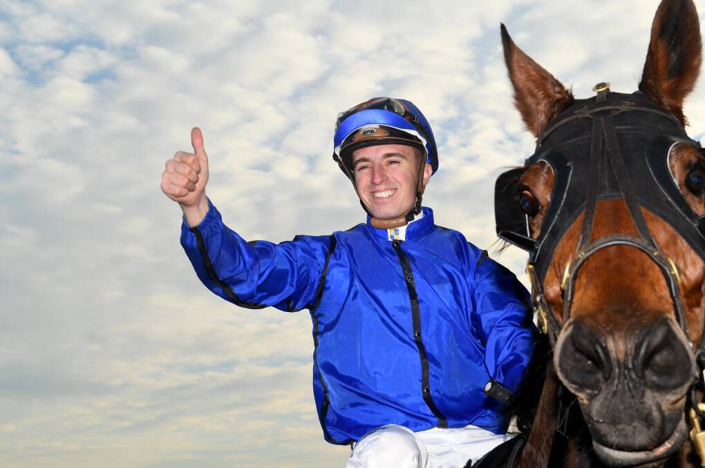 IN THE SADDLE: Josh Adams, pictured after a Group 2 win with Happy Clapper in September, will ride for Michael Lunn on Saturday. Photo: BRENDAN ESPOSITO/AAP