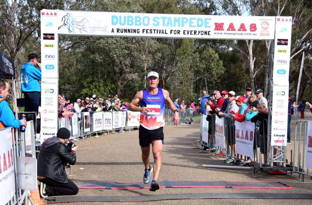 WINNER: Tim Gowing crosses the line to win Sunday's Rhino Ramble marathon at the Dubbo Stampede. Photo: BELINDA SOOLE