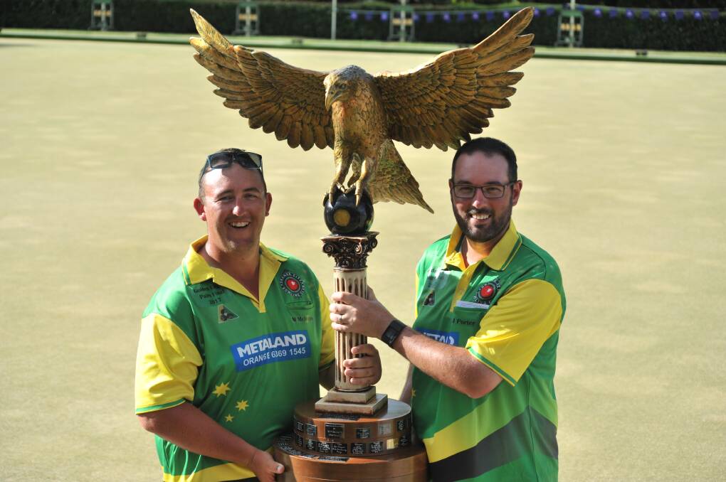OH, WHAT A WIN: Mat McIntyre and Jay Porter pose with the famous Golden Eagle trophy after winning an incredible final at Orange City Bowling Club on Thursday afternoon. Photo: JUDE KEOGH