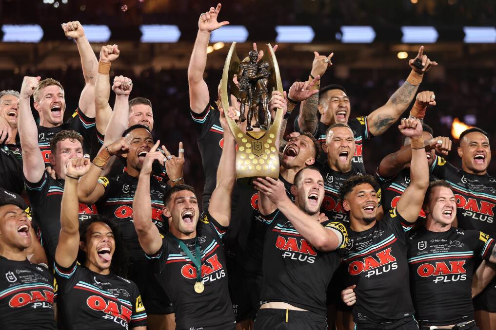 Isaah Yeo and Nathan Cleary hold the premiership trophy aloft after Penrith's amazing NRL grand final win on Sunday night. Picture by Matt King/Getty Images
