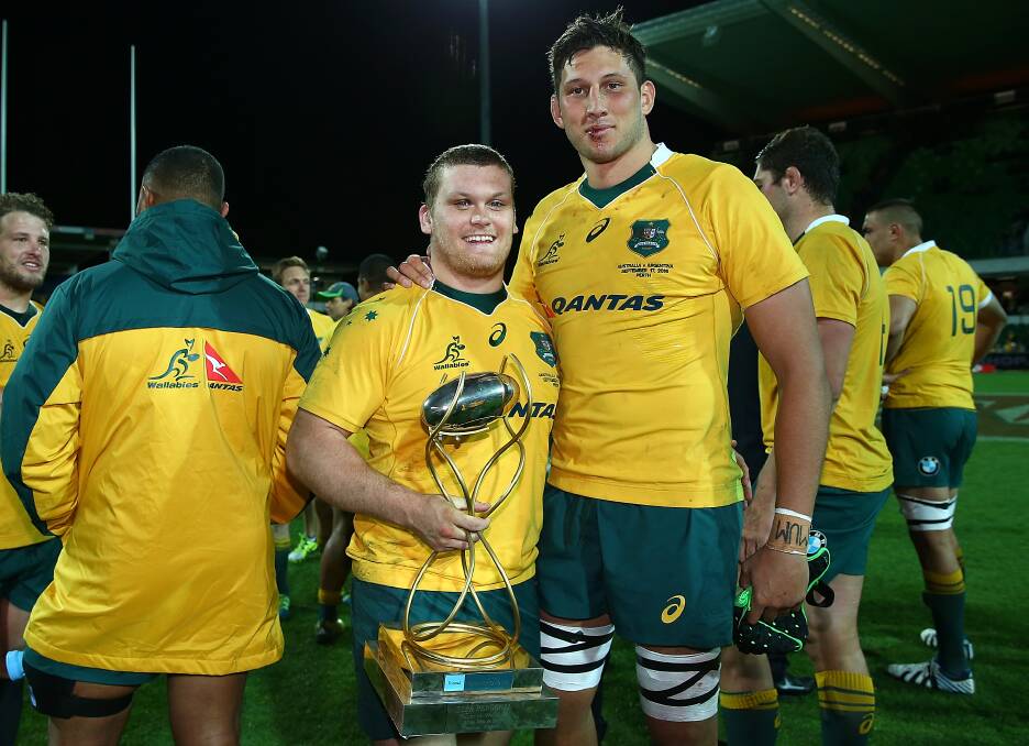 ALL SMILES: Dubbo junior Tom Robertson (left), pictured with teammate Dean Mumm, debuted for the Wallabies on Saturday night. Photo: GETTY IMAGES