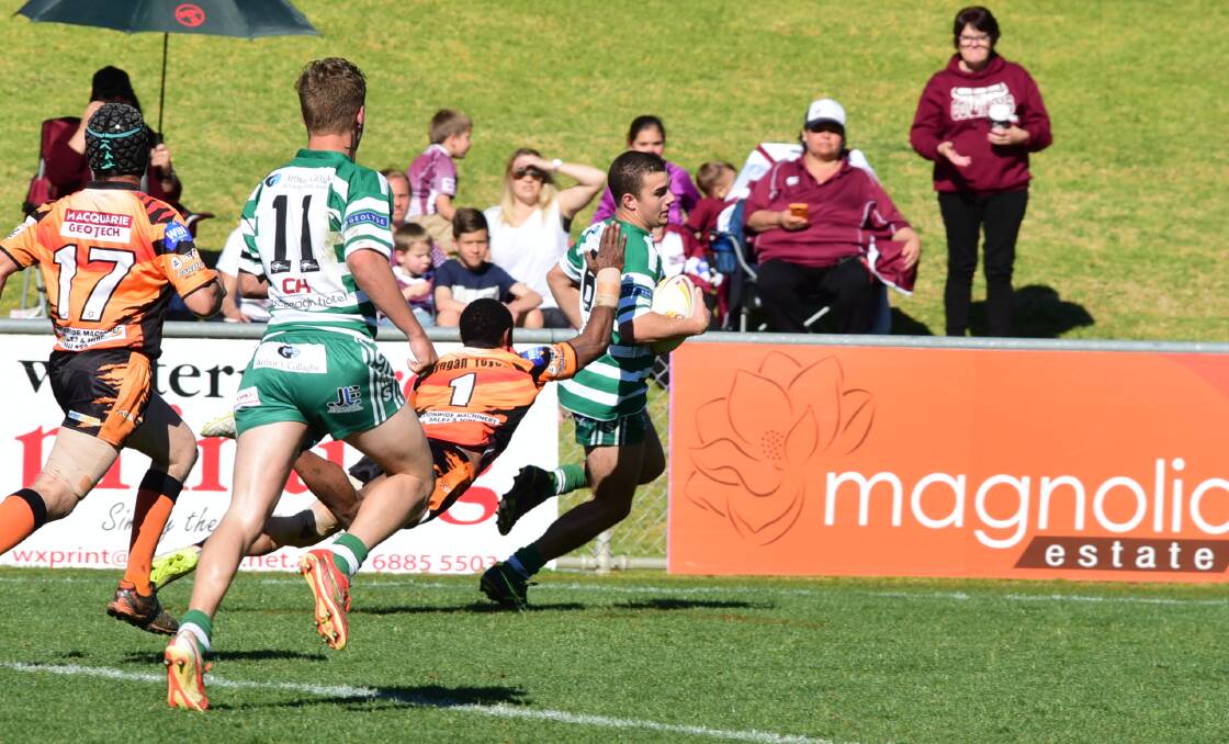 HE'S GETTING AWAY: Alex Bonham evades the Nyngan defence on his way to setting up one of CYMS' tries. Photo: BELINDA SOOLE