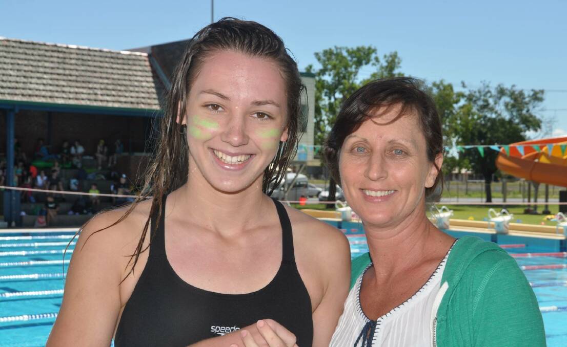 MAKING WAVES: Rising star Olivia Watmore poolside in Dubbo with her mother Lisa Watmore. Photo: CONTRIBUTED