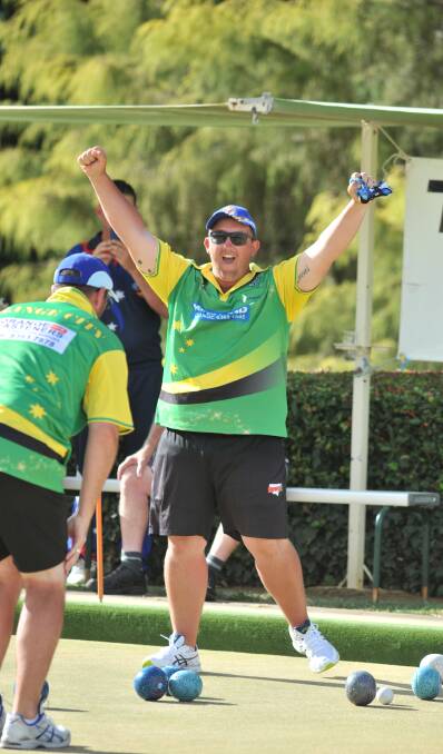 VICTORY: Mat McIntyre celebrates after watching Jay Porter's final and match-winning bowl in the Golden Eagle decider on Thursday afternoon. Photo: JUDE KEOGH