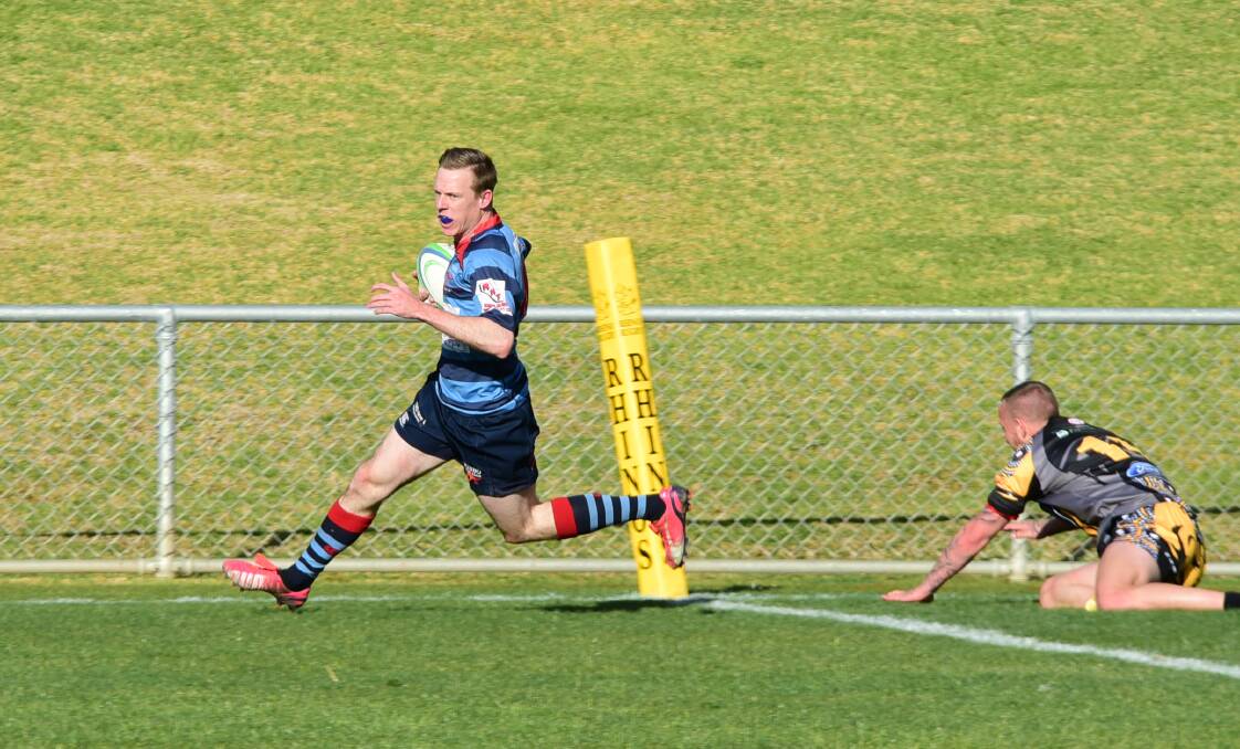 DOUBLE DELIGHT: Isaac Kinscher leaves a defender in his wake on his way to scoring one of his two tries on Saturday. Photo: BELINDA SOOLE