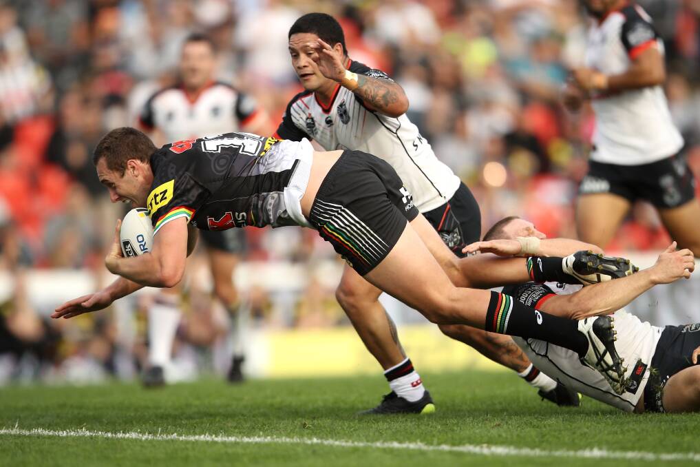 TRY TIME: Isaah Yeo goes in for the first of his two tries during Penrith's miraculous win over the Warriors on Saturday. Photo: GETTY IMAGES