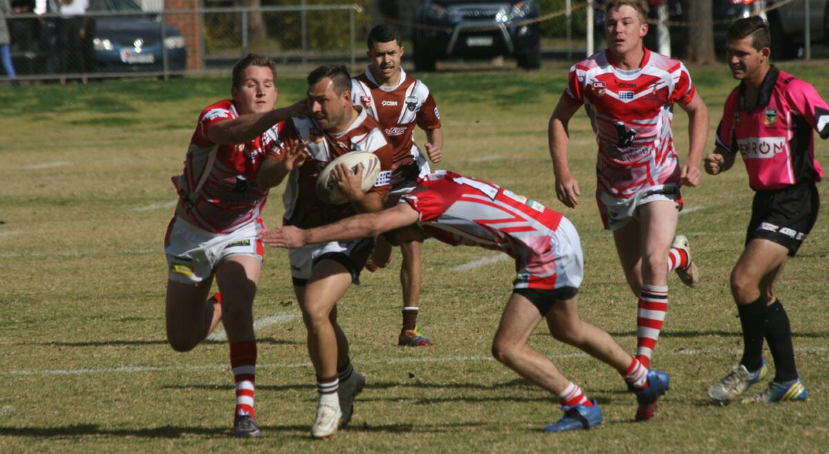 CHARGE: Gilgandra captain Jamie Towney takes on the defence during his side's win on Saturday. Photo: STEPHEN BASHAM