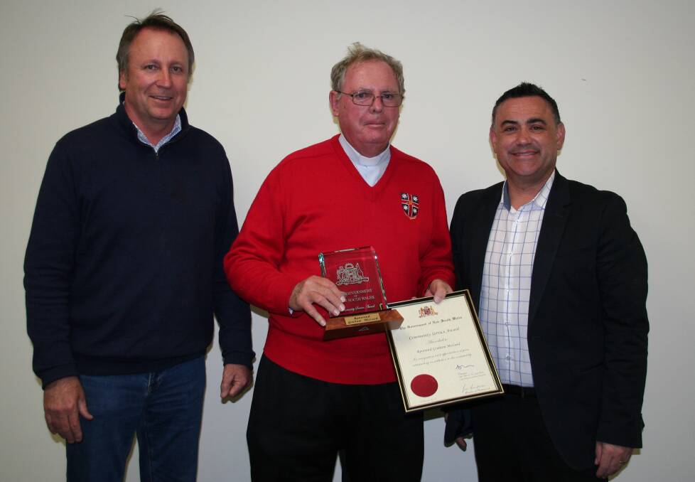 Reverend Graham McLeod receiving the Premier's Community Service Award presented by deputy premier John Barilaro and Member for Barwon Kevin Humphries.