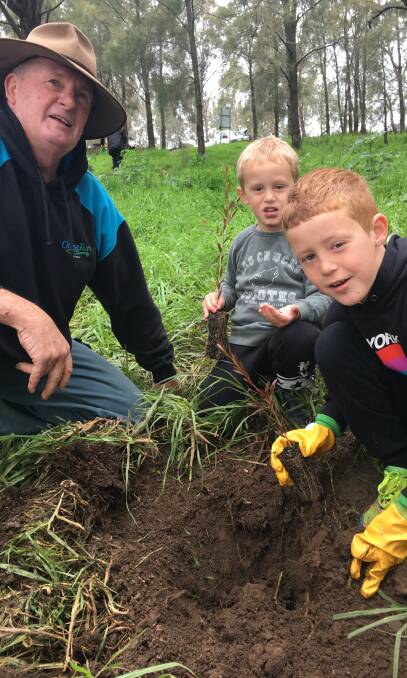 National Tree Day: Mick, Archie and Cooper O’Neill got their hands dirty over the weekend.