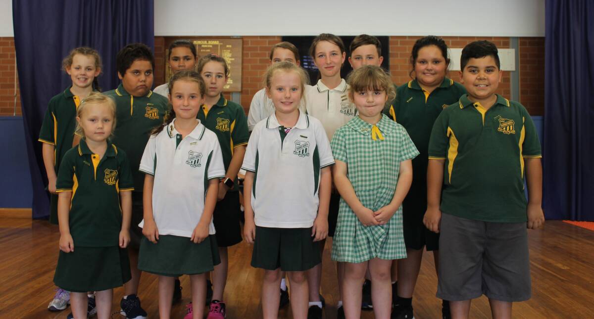 Class Captains for Term 1 having their badges pinned on at the Captain’s assembly.