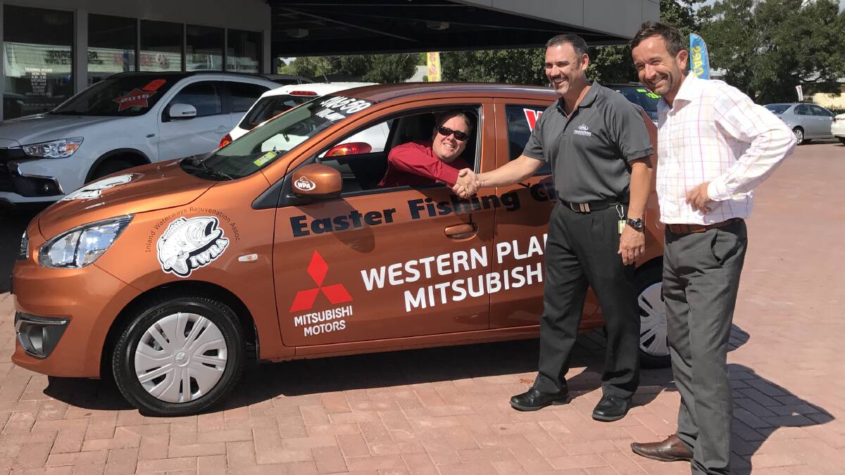 Great prize: Western Plains Mitsubishi’s Grant Spencer and Ben Draper present Matt Hansen with the car to be given away at the Classic. 