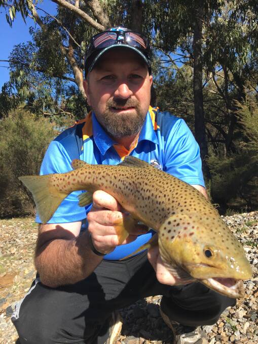 BRING IT ON: With trout season officially opening this weekend, Dubbo fisher Luke Evans will be keen to get amongst some more 'big browns' like this one. Photo: CONTRIBUTED