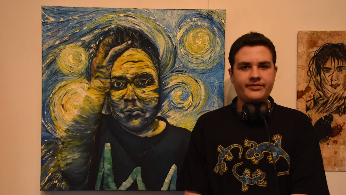 Will Hazard, pictured at the exhibition opening on Saturday night, from the Dubbo School of Distance Education with his prize winning painting. Photo: Lizz Dobson