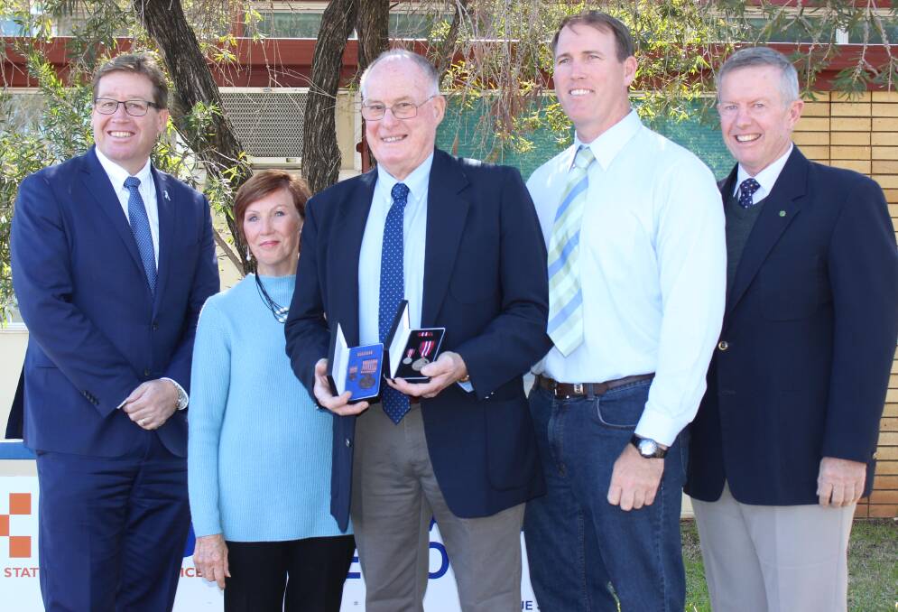 Proud recipient: Deputy Premier Troy Grant, Melva, Mike and Simon Blake, and federal Member for Parkes Mark Coulton. Photo: CONTRIBUTED