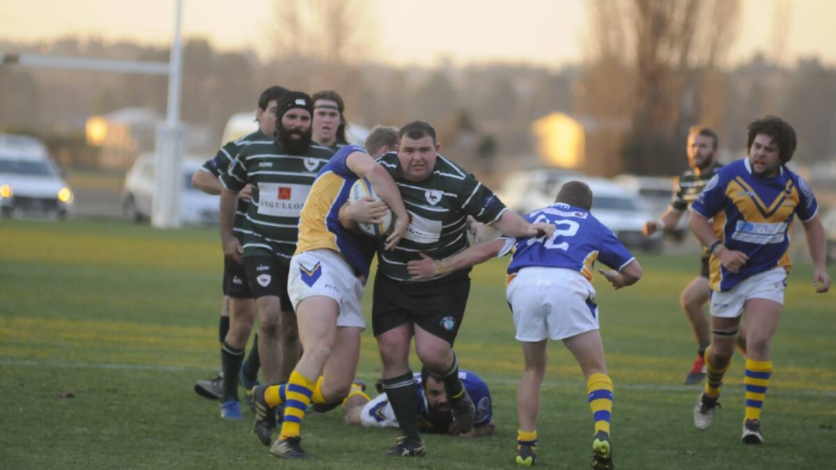 HITTING THE LINE: Emus prop Michael Graham takes a huge carry in Saturday's bonus point win over Bulldogs, which keeps the greens undefeated. Photo: CHRIS SEABROOK