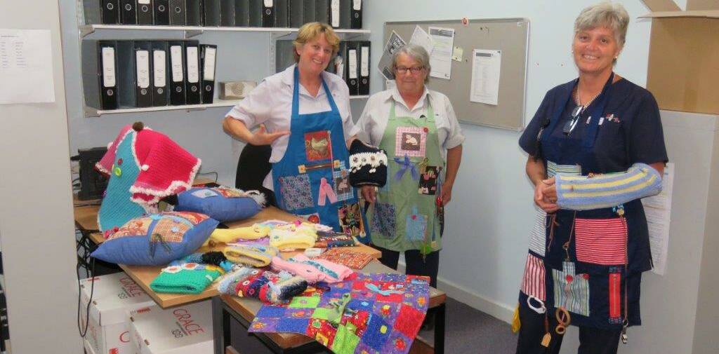 Donations: Jenny Wilde, Bev Sparkes and Cath Brady show some of the items that will go into the distraction boxes. Photo: CONTRIBUTED