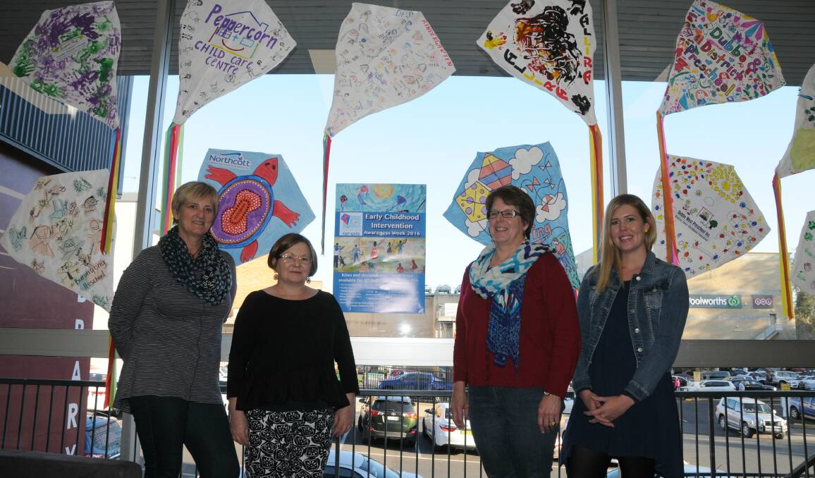 Works of art: Lorna Brennan, Stacey Baird, Lynne Draper and Lauren Memorey with some of the kites at the Dubbo Macquarie Regional Library.
