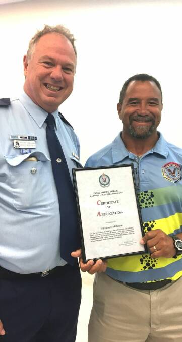 Final honour: Assistant Commissioner Geoff McKechnie presents Willie Middleton with a certificate of appreciation for his years of service. Photo: CONTRIBUTED