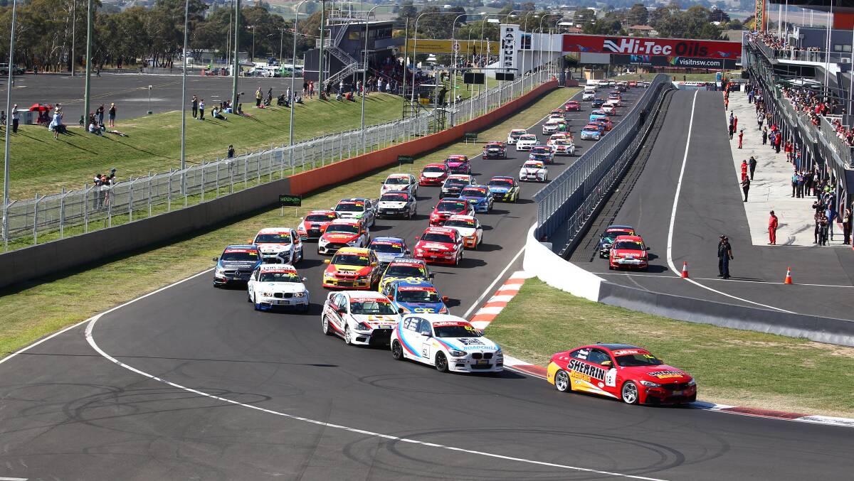 Racing: The 64-car field including Dubbo's Tyler Everingham sets off up Mount Panorama for the first lap of the Bathurst 6 Hour. Photo: PHIL BLATCH