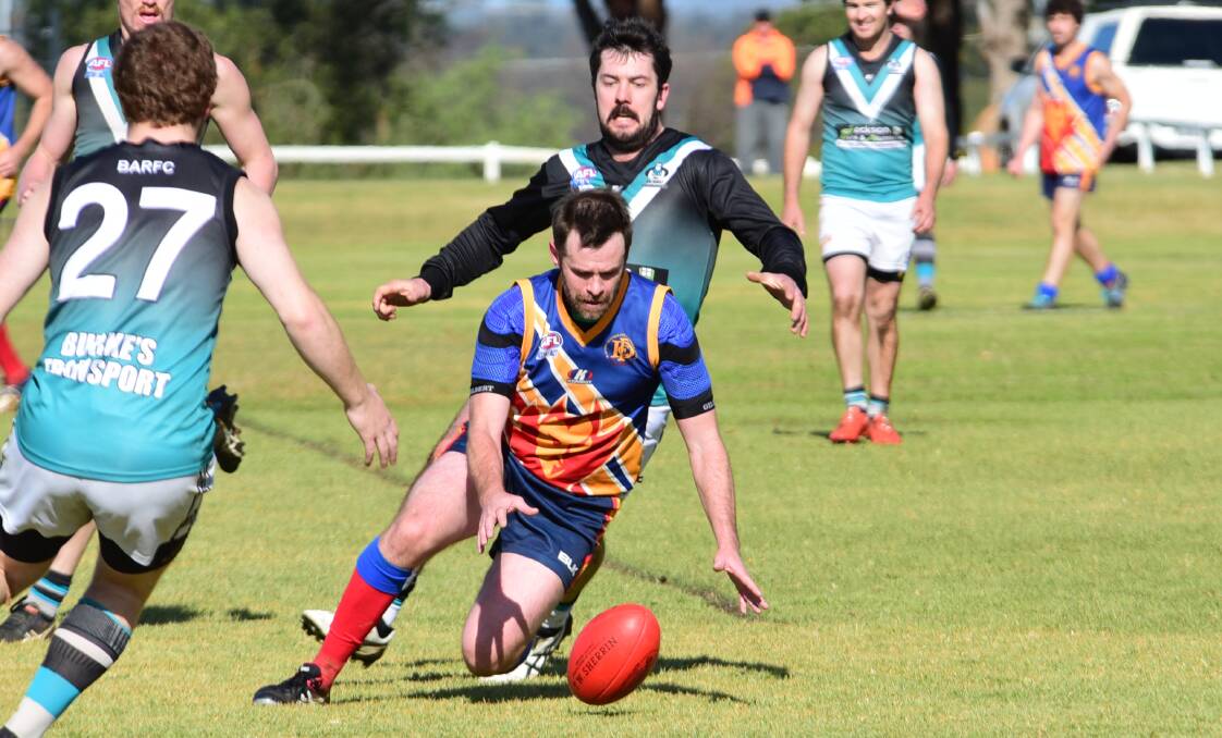 Eyes on the prize: Dubbo's Kim Woodman goes for the ball in a recent match against the Bathurst Bushrangers Outlaws. Photo: BELINDA SOOLE
