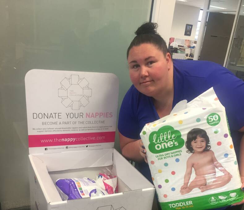 Every nappy helps: Dubbo Neighbourhood Centre's Teagan Martin with the donations received during the recent Nappy Collective appeal. Photo contributed.