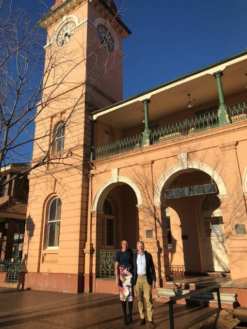 New chapter: Jillian Kilby and Telstra CEO Andy Penn discuss the future of the Dubbo Telephone Exchange and its iconic clock tower. Photo contributed.