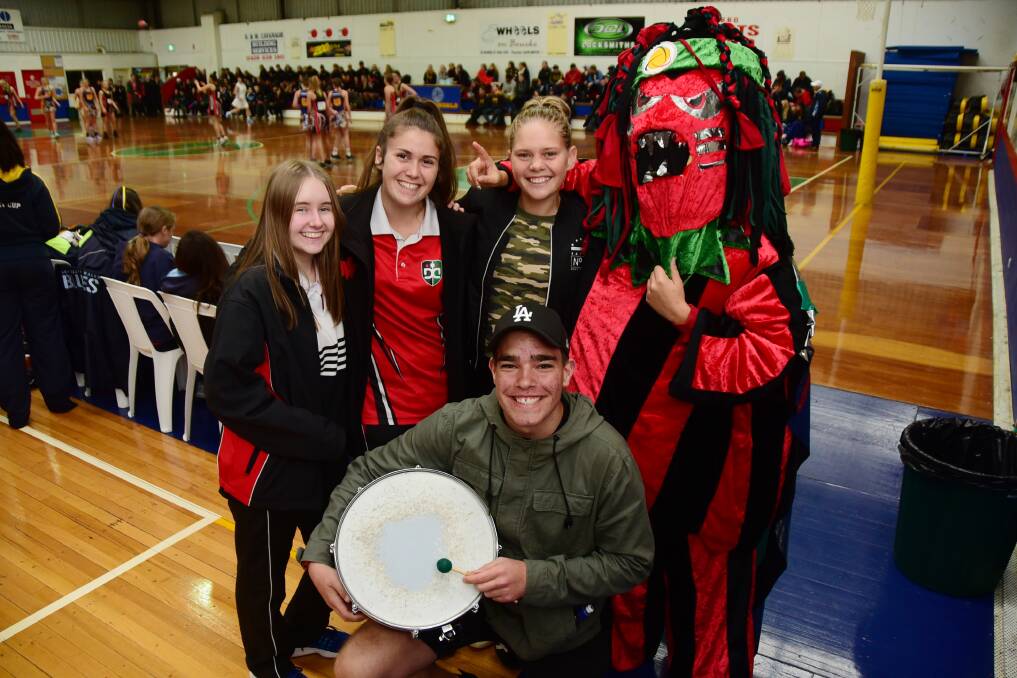Upbeat: Former Dubbo College student Krystal Dallinger (second right) reunites with friends Kasey Allen, Sheridan Munro, Jamarra Elemes in the 'Oigle' mascot suit and Jarrod White. Photo: BELINDA SOOLE. 