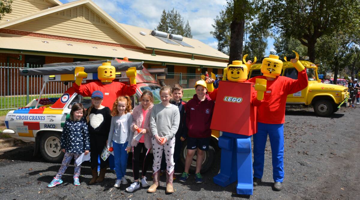 Epic: Lily Stevens, Myah Hunt, Lucy Carney, Emily Smith, Daisy Smith, Oli and Toby Stevens welcome the 'Lego men' Variety team to town. Photo: FAYE WHEELER