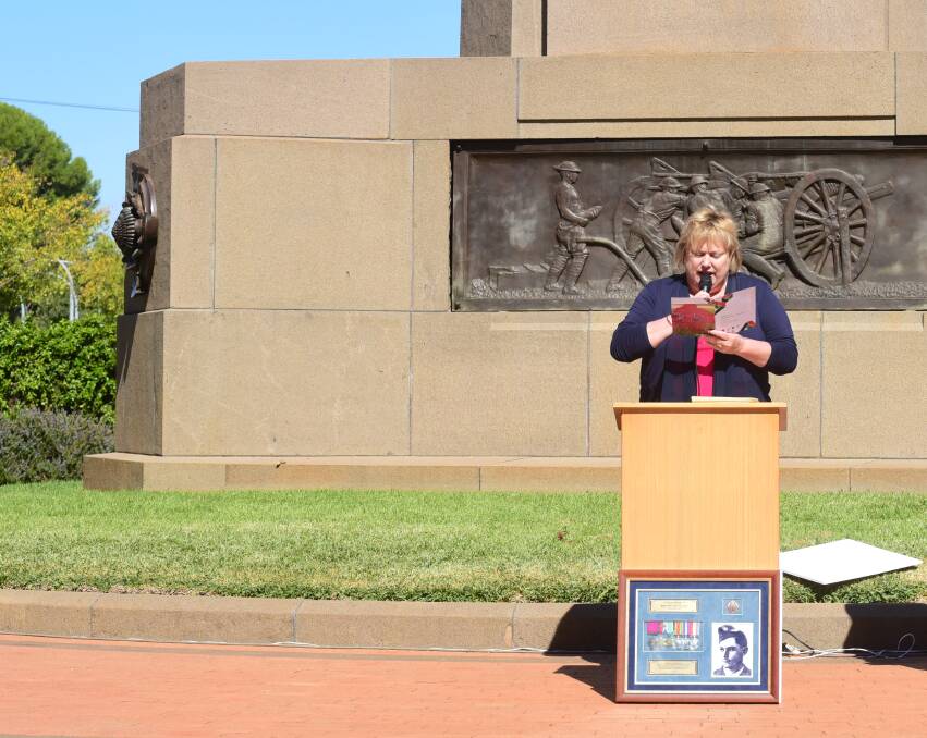 Ann-marie Furney recites 'The War Generation: Vale' at the remembrance service, with the tribute to Victoria Cross winner Rawdon Middleton placed at the podium. Photo: PAIGE WILLIAMS