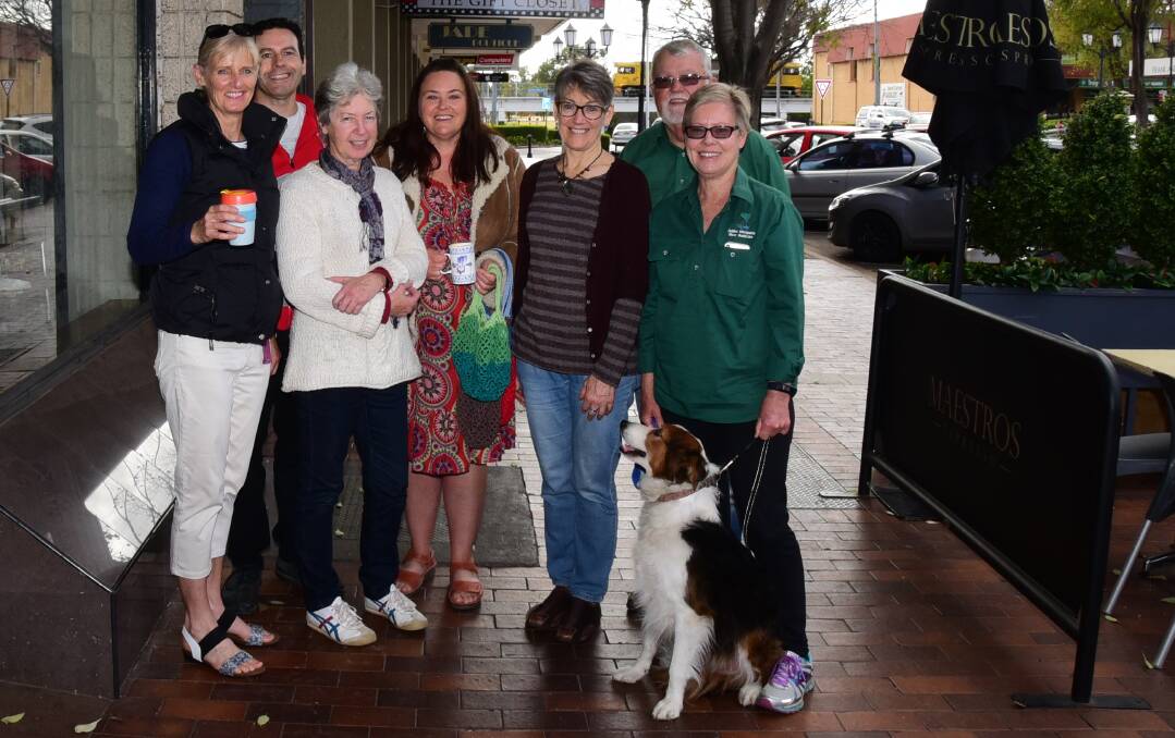 Sustainable: Dubbo Macquarie River Bushcare's Libby McIntyre, Tim Ferraro, Pat Nethery, Melissa Gray, Cheryl Fitzpatrick, Phil and Annette Priest and Gemma the dog support reusable coffee cups. Photo: PAIGE WILLIAMS