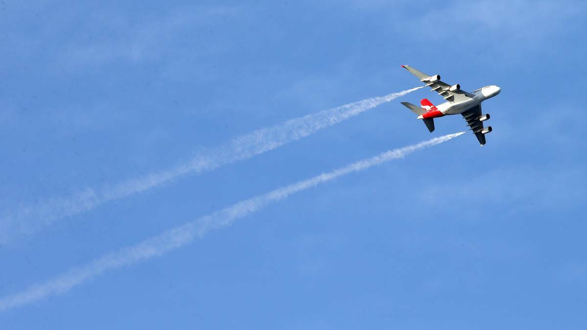 Qantas plane in the sky. Photo: Sylvia Liber