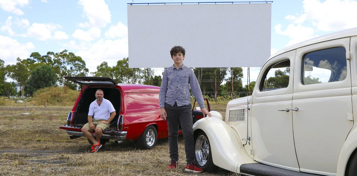 Time to shine: Dubbo Regional Council's Jason Yelverton and Phoenix Aubusson-Foley with classic cars at the drive-in. Photo contributed.