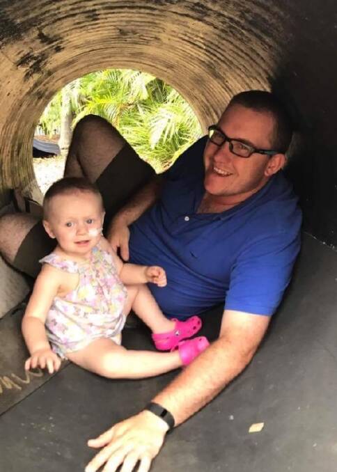 Helping hand: The Wellington community has raised funds for Grace Sharp, pictured with dad Keiran. The two-year-old is fighting cancer for a second time. 