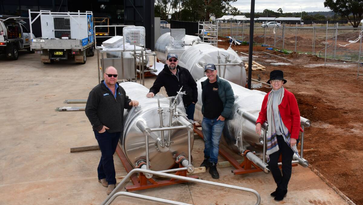 Big kit: Devil's Elbow Brewery co-founders Paul Knaggs, Brendon O'Sullivan and Melissa Knaggs and (second right) head brewer Lachlan MacBean with the brew kit. Photo: BELINDA SOOLE