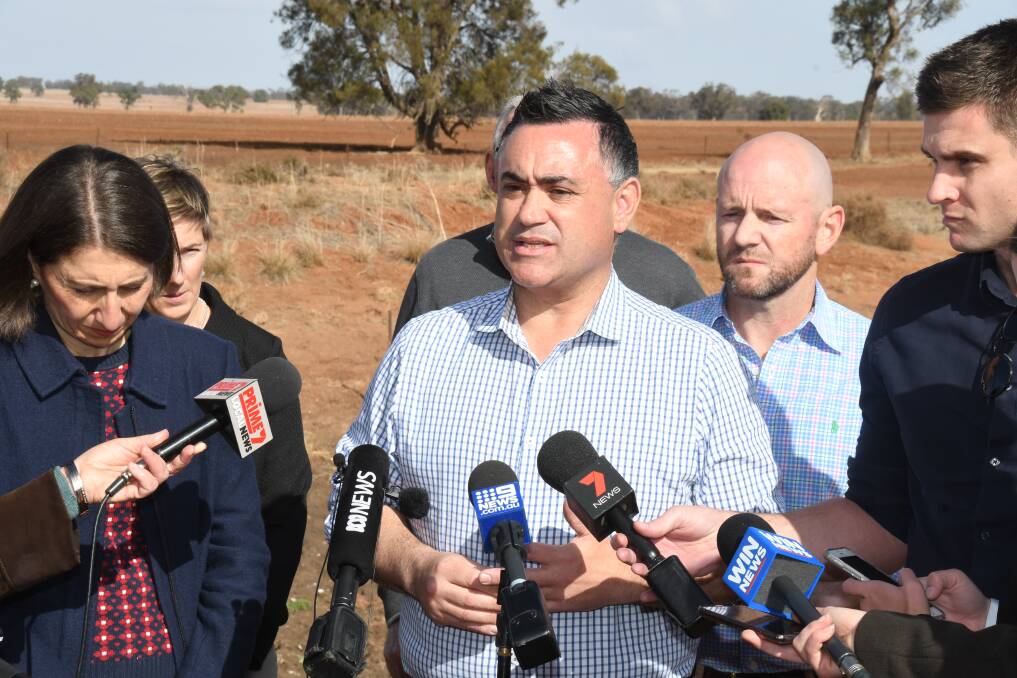 Drought: NSW Deputy Premier John Barilaro faces the media during a visit to a farm north-west of Dubbo in June 2018. Photo: BELINDA SOOLE