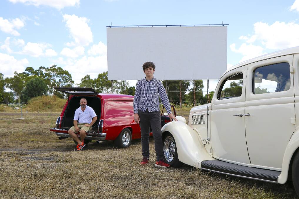 The return of an icon: Dubbo Regional Council youth development officer Jason Yelverton and Phoenix Aubusson-Foley with classic cars ready for the projector to be flicked on at the drive-in. Photo contributed.