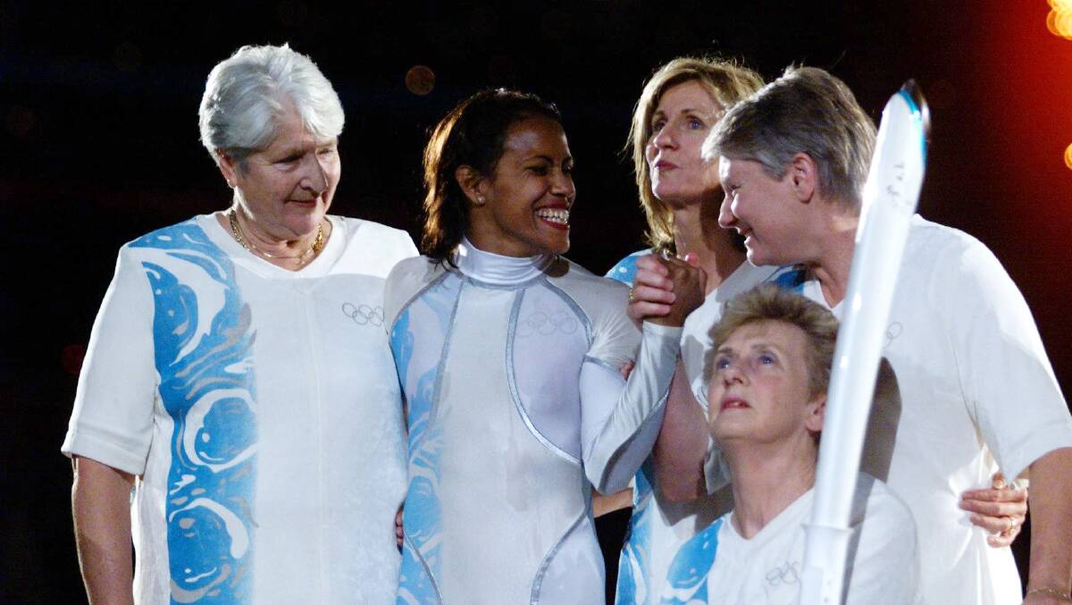 Legendary: 'Golden Girl' Betty Cuthbert (front) takes part in the opening ceremony of the 2000 Sydney Games with fellow Olympians Dawn Fraser, Cathy Freeman, Debbie Flintoff-King and Raelene Boyle. Photo: Andy Zakeli.