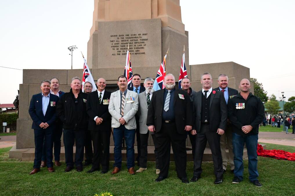 Reunited: Dubbo's Clint Grose (second right) and fellow members of the 8/9 Royal Australian Regiment Association spend Anzac Day together. Photo: BELINDA SOOLE