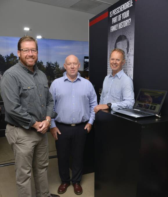Not forgotten: Dubbo MP Troy Grant, Western Plains Cultural Centre manager Andrew Glassop and Belgian Ambassador Jean-Luc Bodson at the exhibition honouring soldiers killed on Flanders battlefields. Photo: BELINDA SOOLE