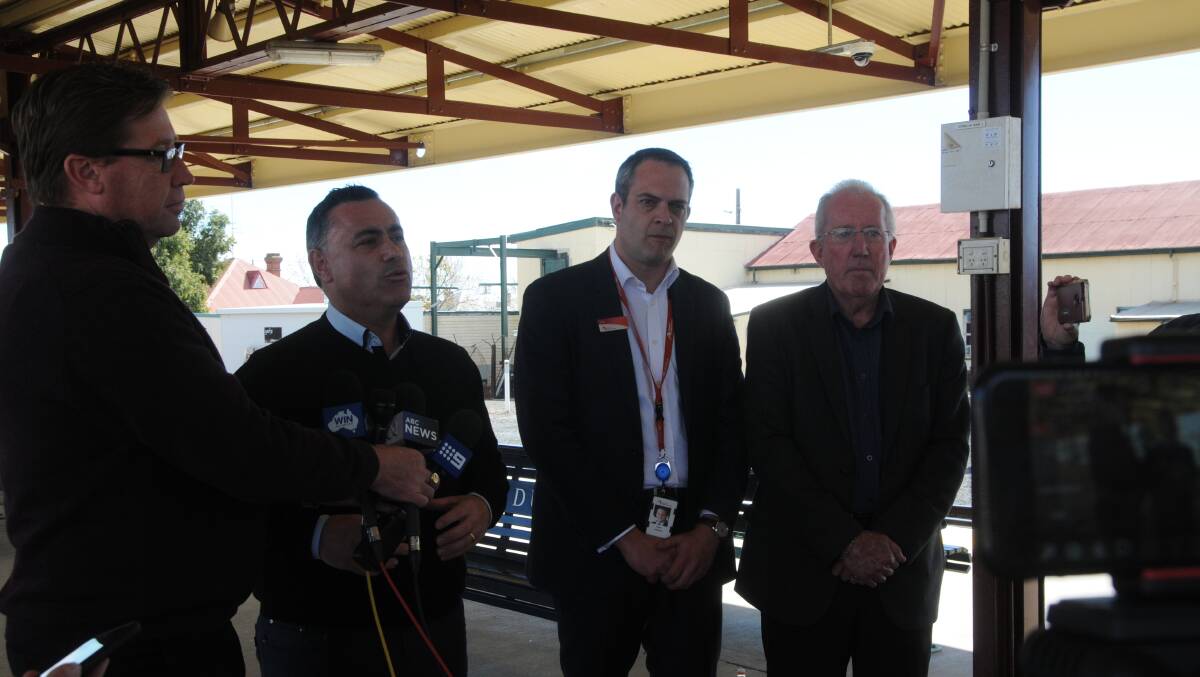 Dubbo MP Troy Grant, Deputy Premier John Barilaro, NSW Trainlink chief operating officer Pete Allaway and Dubbo Regional Council administrator Michael Kneipp at the city's railway station for the train announcement. Photo: LYNN PINKERTON