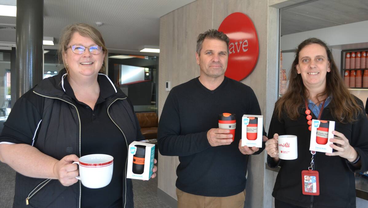 Choice: CSU student liaison officers Cathy Smith and Rob Salt and research project manager Liz Laidlaw with reusable cups. Photo: FAYE WHEELER 