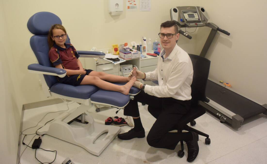 Stepping up: Indiana Daley, a Year 3 student, has a check-up with Dubbo podiatrist Bevan Charlton-White. Photo: JENNIFER HOAR