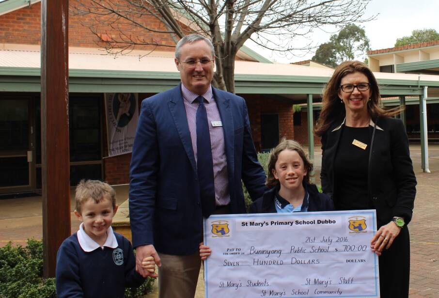 Reaching out: Michael Quade from St Mary's Primary School with Buninyong Public School principal Anne van Dartel and students Isaac and Charlotte. Photo contributed. 