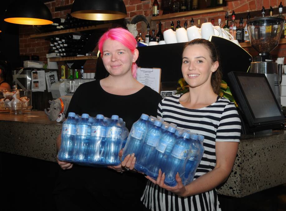 CAFE CARE: Errin Williamson and Ashleigh Wyatt at CSC, where they are providing customers with free bottled water. Photo: JENNIFER HOAR