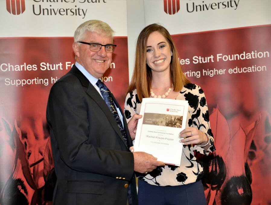 Chair of the Tony McGrane Scholarship Committee, Geoff Wise presents a certificate to the Tony McGrane Scholarship winner, Rachel Krause-Poyser. Photo: SUPPLIED